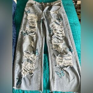 Ripped butterfly jeans